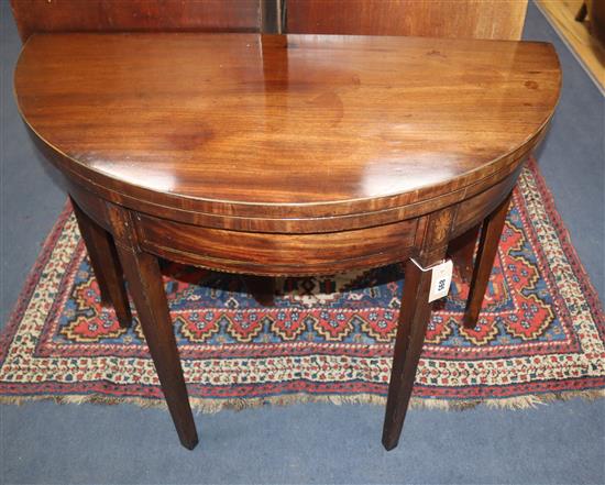 A George III mahogany folding card table W.90cm